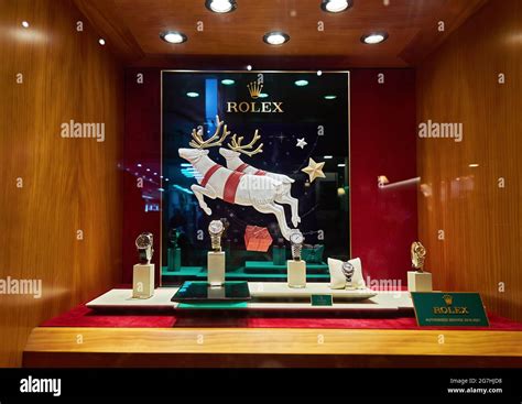 Rolex store window display decorated for Christmas and logo